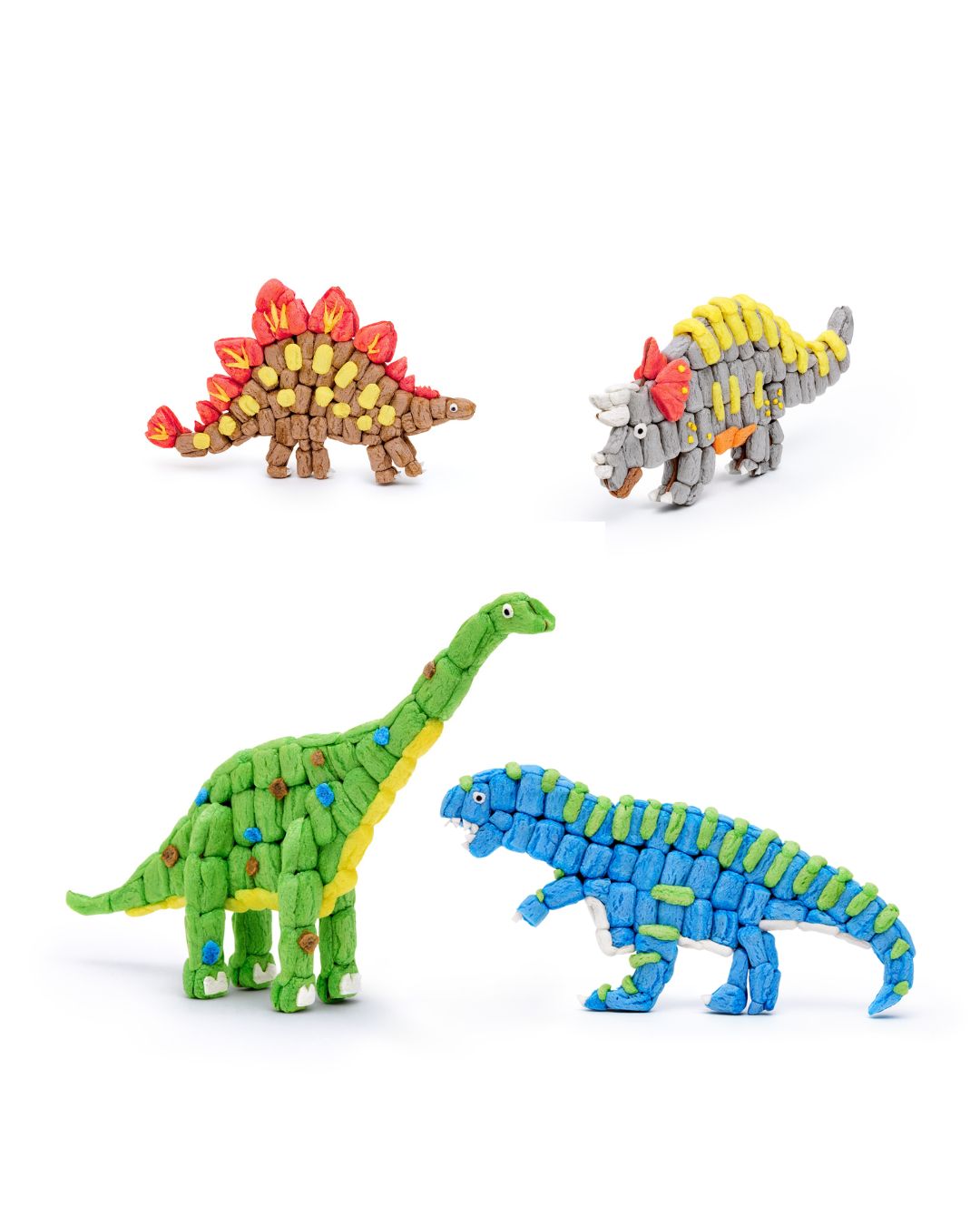 Vier Dinosaurier-Modelle aus Nubsis in verschiedenen Farben auf weißem Hintergrund.