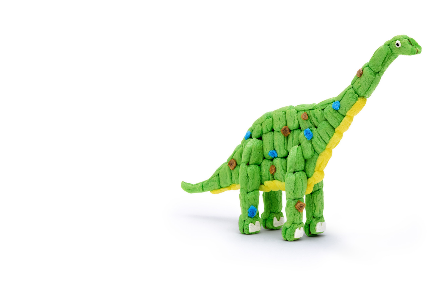 Ein großer Sauropode in Grün.